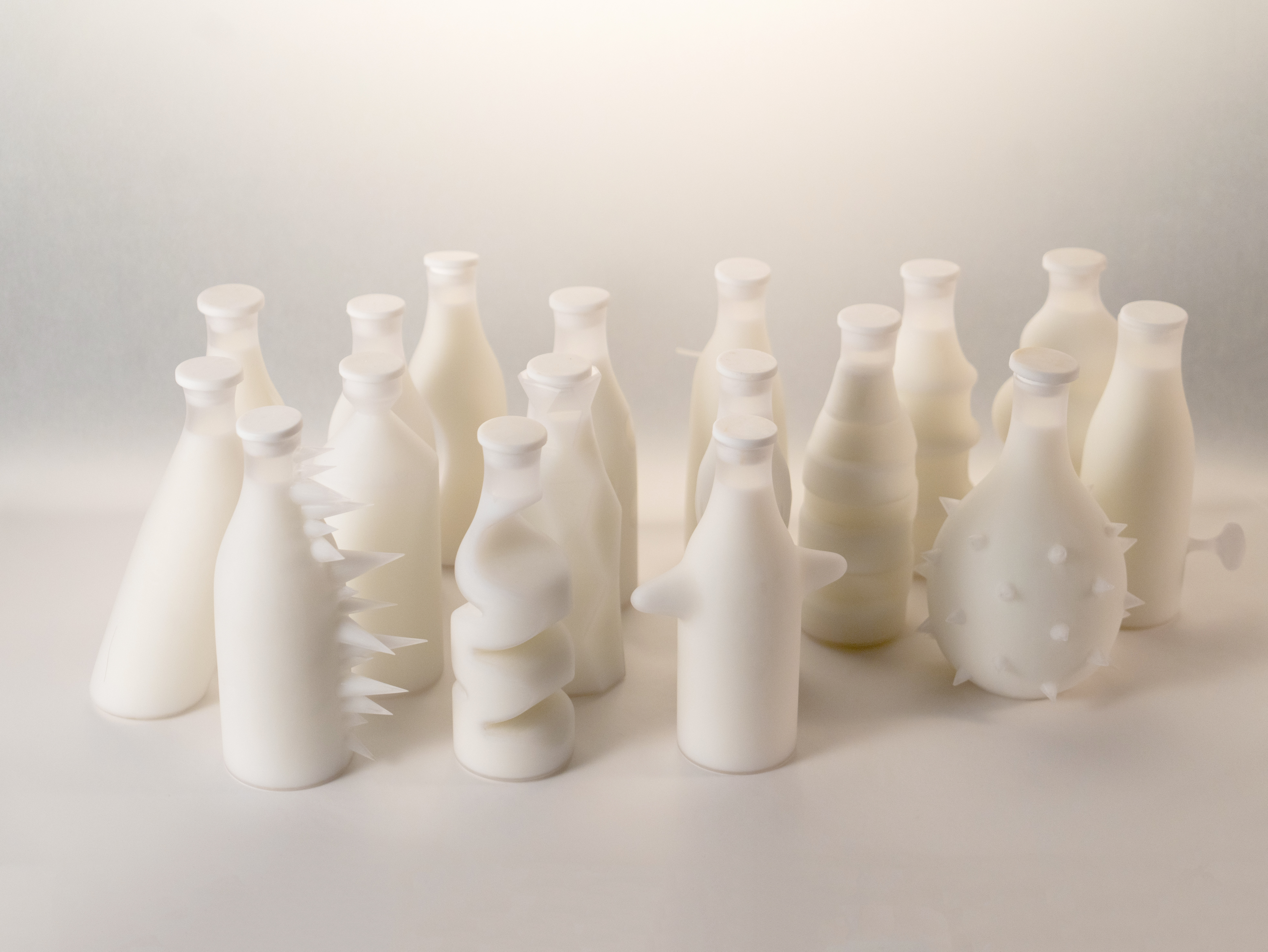 The complete collection of white sculptural milk bottles, photographed together