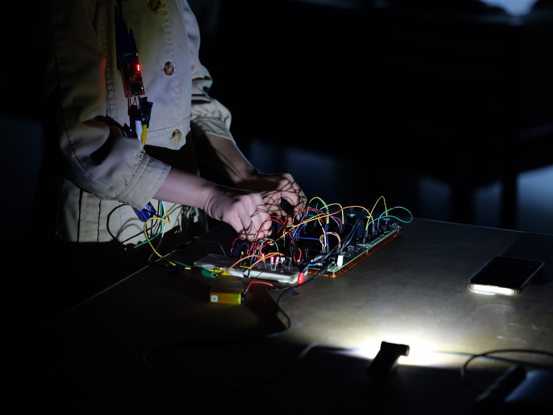 Hands manipulating an electronic circuit during Overlap at STF Düsseldorf